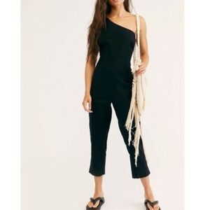 Free People one shoulder jumpsuit. Buttons on side. XS. Used, in good condition.
